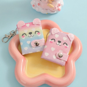Glittering unicorn and puppy mini notebooks with rainbow and pink heart designs and keychains