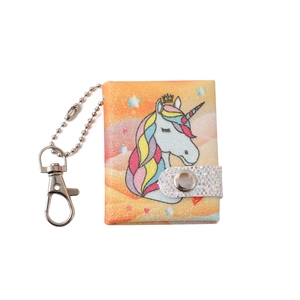 Detail of mini unicorn glitter notebook keychain with golden crown and silver buckle