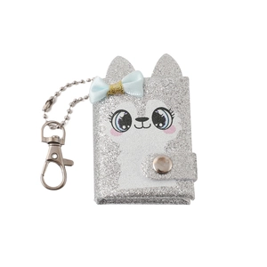 Detailed view of silver glitter mini notebook with cartoon animal and blue silk bow