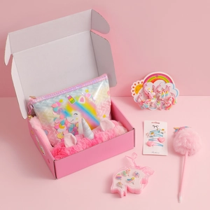 Detailed set of unicorn stationery and hair accessories in a pink gift box display