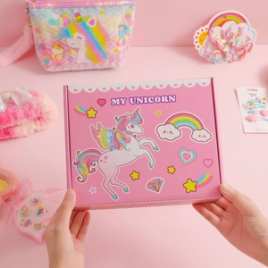Pink unicorn gift box set with matching sequin bag and rainbow hair accessories for girls