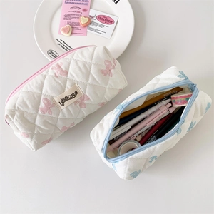 Quilted bow pencil case with butterfly print for stationery or makeup storage