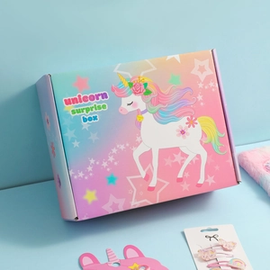 Unicorn surprise box gift set with pink and blue gradient design and cartoon illustration
