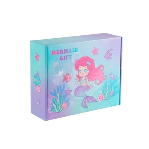 Detail der blau-violetten Meerjungfrau-Geschenkbox mit Meeresmustern und Cartoon-Kunst