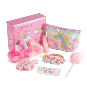 Pink plush unicorn stationery set with glitter bag and hair accessories in a gift box