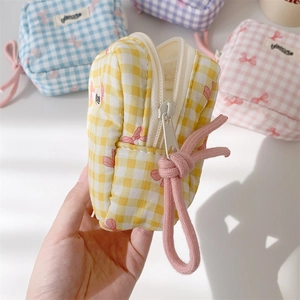 Mini checkered makeup pouch with pink bow print and cotton rope zipper pull in pastel colors