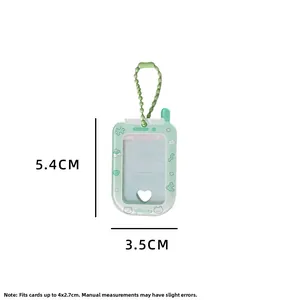 Macro view of green phone-shaped mini photo frame keychain with a heart cut-out window