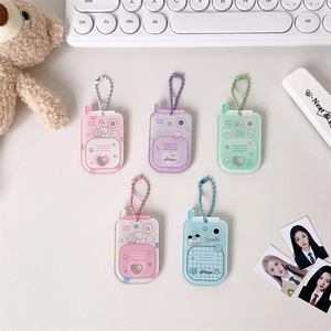 Detail view of five pastel acrylic mini card holders in cute mobile phone shapes