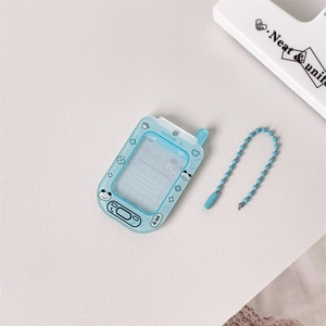 Close-up of sky blue game console shaped keychain with cartoon panda and bead chain