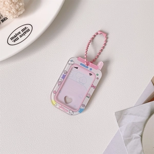 Detail of pink phone-shaped acrylic photo holder with heart window and cat motifs