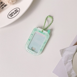 Close-up of light green acrylic mini photo holder with heart cutout and bead chain