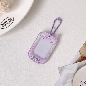 Detail view of purple acrylic phone-shaped photo card holder with cute cat pattern