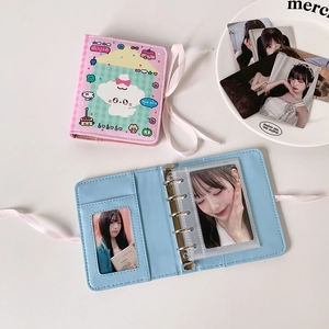 Close-up of M5 3-inch photo album with 3-ring binder and silk ribbon bow closure