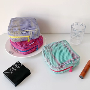 Three-piece set of colorful mesh square cosmetic bags in purple, rose, and mint green
