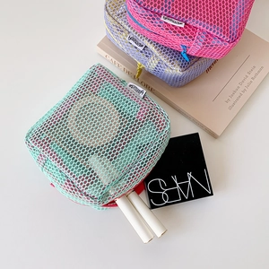 Mesh cosmetic bags in pink, purple, and green for makeup and sanitary pad storage