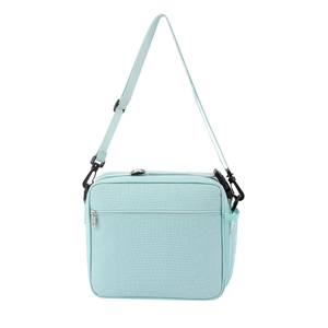 Détail de la bandoulière réglable et de la poche en filet du sac à déjeuner vert menthe