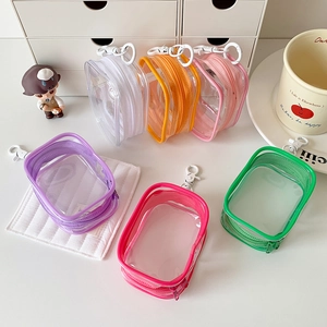 Set of six colorful transparent PVC mini doll display bags with hooks and zippers