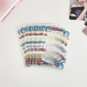 Detailed view of clear card sleeves with summer-themed cute cartoon penguin and food prints