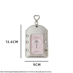 Detail of silver metallic photocard holder with heart clip and ribbon eyelets