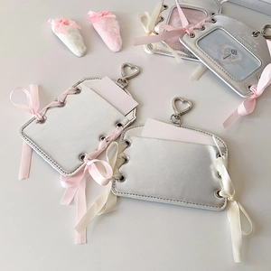 Silver ballet-style photo card holder with ribbon bows and heart-shaped metal clasp