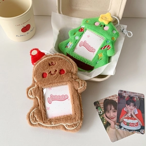 Detail of plush gingerbread man and Christmas tree card holders with transparent PVC windows