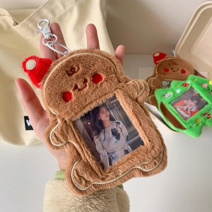Christmas plush photo card holder with ginger bread and tree designs on a tote bag