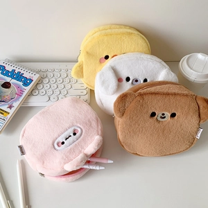 Macro detail of plush animal-shaped storage bags showing soft texture and compact capacity