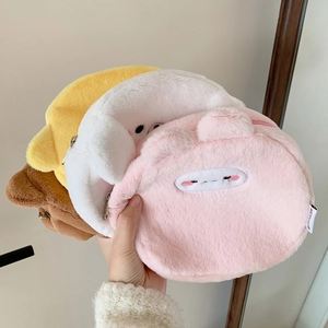Close-up of soft plush animal storage pouches with cute embroidery and metal zippers