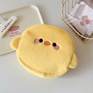 Detail of cute yellow plush chick storage bag with fine embroidery and small 3D wings