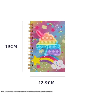 Detail view of unicorn pop-it notebook showing 19x12.9cm dimensions and 80 sheets