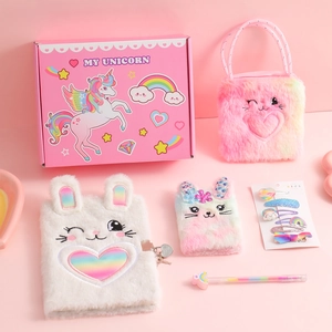 Pink unicorn stationery gift set featuring plush notebook, handbag, and hair accessories
