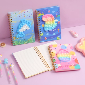 Detail of Pop-it sensory notebook covers with spiral binding and matching cartoon pens