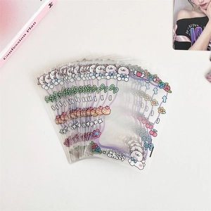 Stack of clear 3-inch photo card sleeves with sheep and floral cartoon patterns