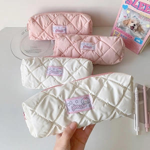 Quilted cloud-style pencil case in pastel pink and white with cute puppy woven label