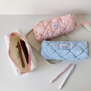 Quilted pastel pencil cases in pink, blue, and white with large capacity and cute labels