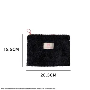 Detail view showing black plush cosmetic bag dimensions: 20.5cm width and 15.5cm height