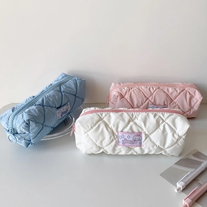 Quilted cream-colored stationery pouches in blue, pink, and white with cinnamoroll patch