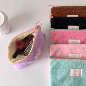 Fuzzy sherpa cosmetic bag set in multiple colors with pink circular zipper pulls