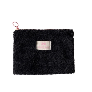 Portable black plush envelope cosmetic bag with pink zipper pull and cute bow label