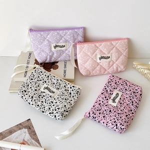 Quilted mini pouches set in lavender and pink colors with stylish ink splatter patterns