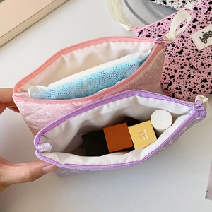 Quilted ink-splash mini pouches in pink and purple for cosmetics and daily accessories