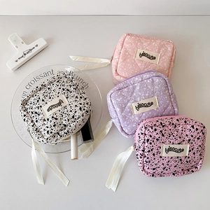 Quilted leopard print makeup bags in various colors with ribbon zipper puller