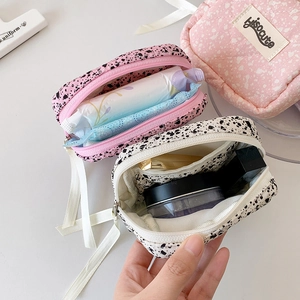 Portable ink splash leopard print cosmetic bags in pink and white for travel organization