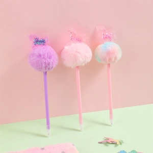 Close-up of unicorn pom-pom pens with glitter sequins and colorful plush balls