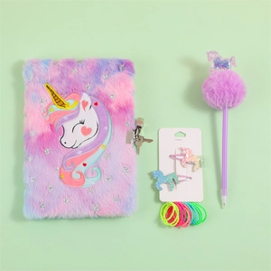 Detailed view of unicorn plush diary set with sequin pen and hair accessories for girls