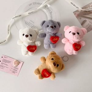 Four colorful plush bear keychains with red LOVE hearts for backpack accessory