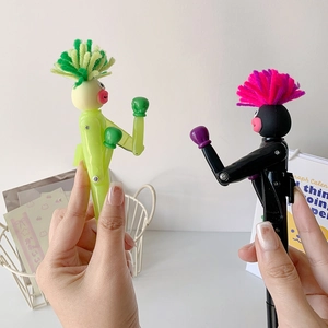 Funny monster boxing pens in black and green with fuzzy hair and punching action feature