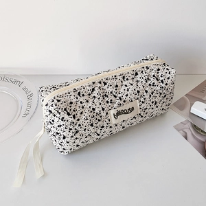 Detail of quilted cotton pencil case with ink splash pattern and Hisocute brand label