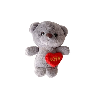 Cute gray plush bear keychain with red heart and LOVE embroidery on white background