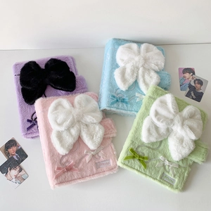 Detail of plush A5 binder covers in pastel colors with large decorative bow accents